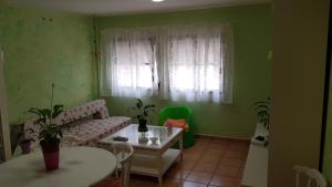a living room with a couch and a table at Herosa vacacional in Bajamar