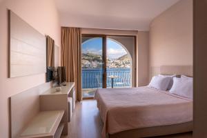 Postel nebo postele na pokoji v ubytování PALMA city HOTEL