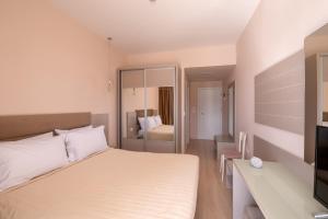 Postel nebo postele na pokoji v ubytování PALMA city HOTEL