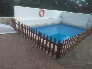 a swimming pool with a fence around it at VILLA GARDEN in Tarragona