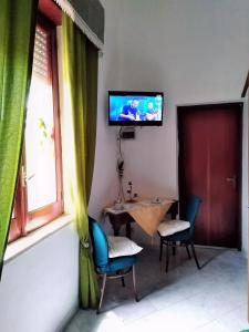 TV a/nebo společenská místnost v ubytování L'ANTICA TORRE