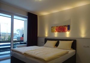 Postel nebo postele na pokoji v ubytování Aktiv Hotel Winterberg