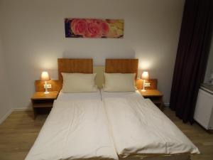 Postel nebo postele na pokoji v ubytování Aktiv Hotel Winterberg