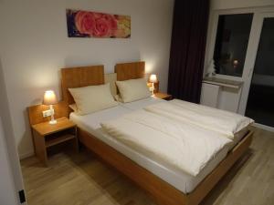 Postel nebo postele na pokoji v ubytování Aktiv Hotel Winterberg