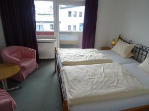 Postel nebo postele na pokoji v ubytování Aktiv Hotel Winterberg