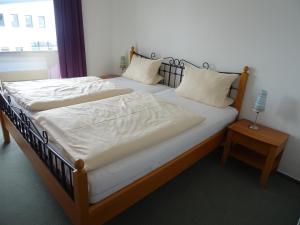 Postel nebo postele na pokoji v ubytování Aktiv Hotel Winterberg