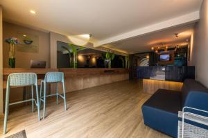 TV a/nebo společenská místnost v ubytování Hotel Blue Concept