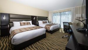 Un pat sau paturi într-o cameră la Hotel Levesque
