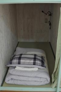 En eller flere senge i et værelse på Kichinan