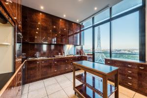 a kitchen with a view of the eiffel tower at Exclusive Stays - Gallery Penthouse in Melbourne