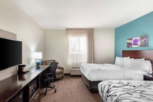 A television and/or entertainment centre at Sleep Inn Lancaster Dallas South