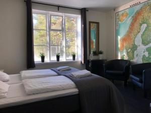Postel nebo postele na pokoji v ubytování Hedenstugan B&B Hotel