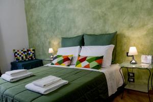 Posteľ alebo postele v izbe v ubytovaní La Locandiera B&B