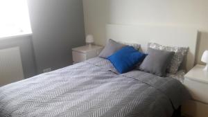 Posteľ alebo postele v izbe v ubytovaní Apartament SZTOKHOLM