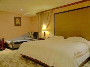 Letto o letti in una camera di Kai Wei Boutique Hotel