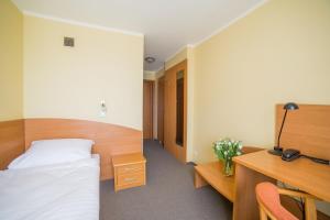 Posteľ alebo postele v izbe v ubytovaní Hotel Gorzów