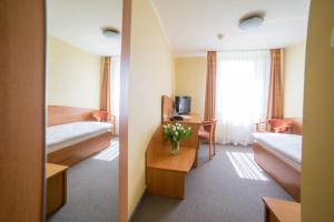 Posteľ alebo postele v izbe v ubytovaní Hotel Gorzów