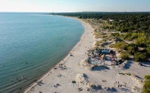 an overhead view of a beach with people in the water at Tofta Resort in Tofta +4 photos