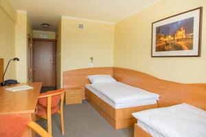 Posteľ alebo postele v izbe v ubytovaní Hotel Gorzów