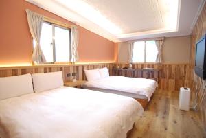 Postel nebo postele na pokoji v ubytování MountainTraveler