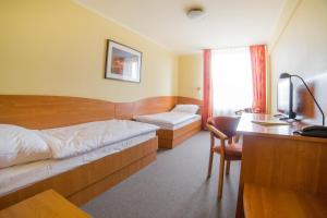 Posteľ alebo postele v izbe v ubytovaní Hotel Gorzów