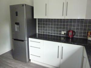 Kjøkken eller kjøkkenkrok på Paisley Central Apartment #4