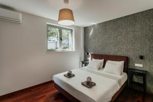 Llit o llits en una habitació de Boka Apartment 5