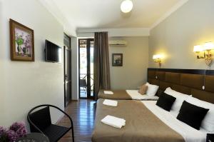 Postel nebo postele na pokoji v ubytování Hotel Marsel
