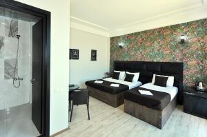 Postel nebo postele na pokoji v ubytování Hotel Marsel