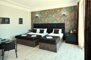 Postel nebo postele na pokoji v ubytování Hotel Marsel