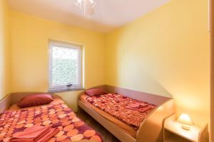 Postel nebo postele na pokoji v ubytování Apartment Josip Malin