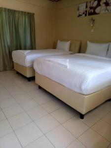 Krevet ili kreveti u jedinici u okviru objekta Sari Pacifica Resort & Spa, Lang Tengah