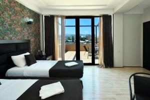 Postel nebo postele na pokoji v ubytování Hotel Marsel