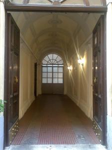 an empty hallway of a building with a ceiling at Hotel Lazzari in Rome