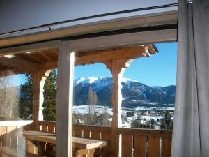 a view from a deck with a view of the mountains at Ker Cerdagne in Bolquere Pyrenees 2000
