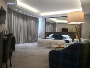 Postel nebo postele na pokoji v ubytování Maximus Hotel Byblos
