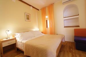 Posteľ alebo postele v izbe v ubytovaní Apartments Kovac Old Town