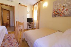 Posteľ alebo postele v izbe v ubytovaní Apartments Kovac Old Town