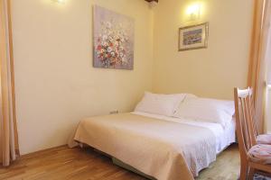 Posteľ alebo postele v izbe v ubytovaní Apartments Kovac Old Town