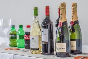 a group of bottles of wine sitting on a table at Glam Hotel Nairobi - Near Westgate Mall, Westlands in Nairobi