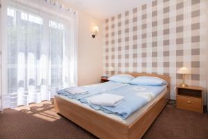 Posteľ alebo postele v izbe v ubytovaní Villa Tara