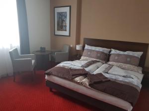 Voodi või voodid majutusasutuse Wellness hotel Harmonie Třeboň toas