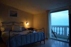 Postel nebo postele na pokoji v ubytování Albergo Tirreno