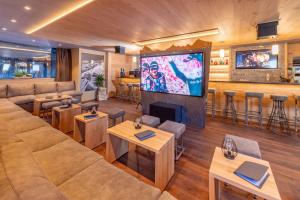 TV a/nebo společenská místnost v ubytování Hotel Heimatlodge
