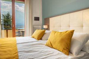 Postel nebo postele na pokoji v ubytování Hotel Limone