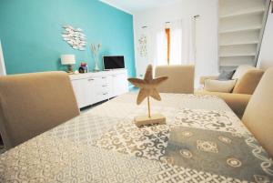 A seating area at Acquamarina - Exclusive Sea House