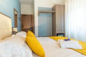 Postel nebo postele na pokoji v ubytování Hotel Limone