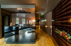 a lobby with a bar and a wine cellar at mOdus Hotel in Varna City