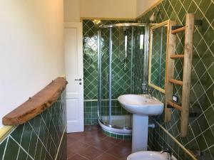 a bathroom with a sink and a shower at Borgo Eleatico in Casal Velino +77 photos