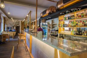 a bar in a restaurant with a counter at Central Apartmany in Starý Smokovec +56 photos